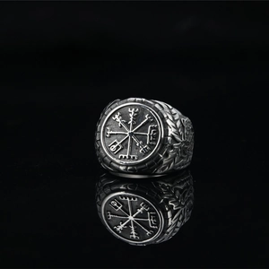 Vintage silver Viking compass ring for men with engraved Nordic patterns on black background