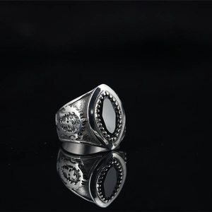 Vintage punk skull motorcycle ring in titanium steel with wings and a black marquise stone