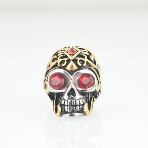 Gothic punk skull ring in silver and gold steel with red rhinestones and engravings