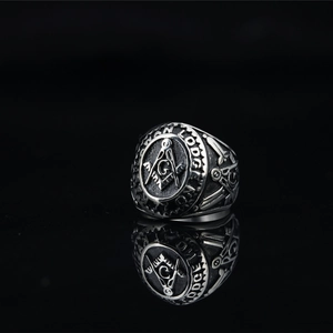 Vintage silver Freemasonry signet ring with square and compass emblem in polished steel