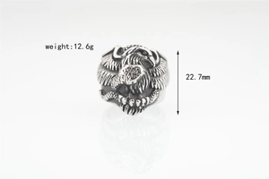 Macro detail of vintage eagle head steel ring showing 12.6g weight and 22.7mm width