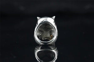 Macro view of vintage titanium steel skull ring showing detailed interior texture and finish