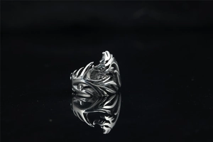 Macro detail of gothic dragon ring in antique silver finish with intricate scale texture