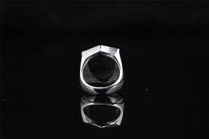 Rear view detail of wide shield ring showing metal thickness and mirror reflection