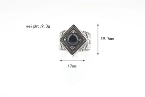 Macro shot of vintage titanium steel ring featuring black onyx inlay and 9.3g weight detail