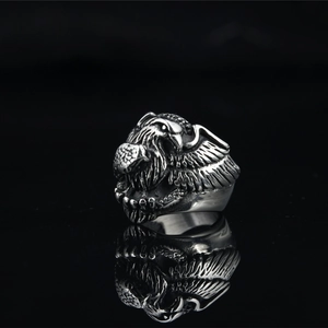 Retro eagle head steel ring with detailed feather texture and polished vintage finish