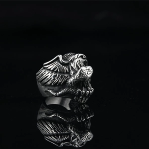 Vintage stainless steel eagle and snake ring with detailed metallic silver finish