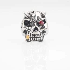 Vintage gothic skull ring for men with red rhinestone eye and gold stud detail