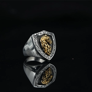 Men's vintage shield ring in silver and gold featuring a detailed horse head relief