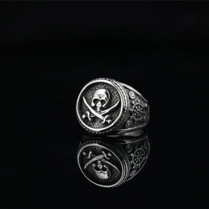 Retro stainless steel pirate skull ring with cross cutlasses and nautical helm detail