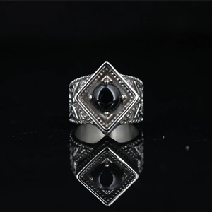 Vintage silver steel ring for men featuring a polished black gemstone and gothic engravings