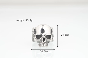 Detail view of gothic skull ring with wing carvings showing 24.5mm height and 15.2g weight
