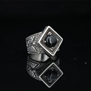 Vintage silver-tone square ring for men featuring a black gemstone and gothic carvings
