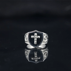 Gothic punk style shield ring with cross emblem and vintage scroll engraving details