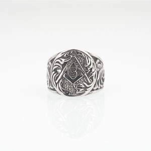 Vintage silver Masonic ring with compass square logo and G engraving in retro punk style