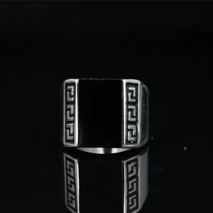 Silver mens punk signet ring with black stone and engraved Greek key patterns