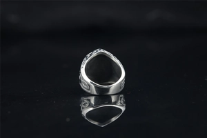 Detailed back view of vintage gothic titanium steel ring with carved totem pattern