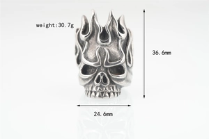 Detailed view of punk skull ring with flame patterns and precise dimension markings