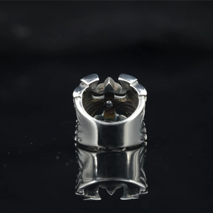 Vintage gothic titanium steel ring with silver cross and fleur-de-lis on black stand