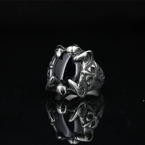 Retro punk dragon claw ring with black oval gemstone and engraved cross details