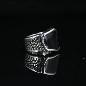 Men's vintage titanium steel ring with black rectangular inlay and textured band
