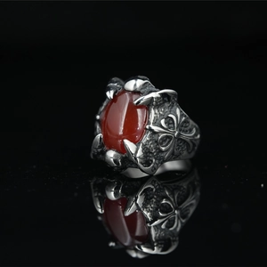 Retro punk dragon claw ring in silver steel with a large red stone and cross engraving