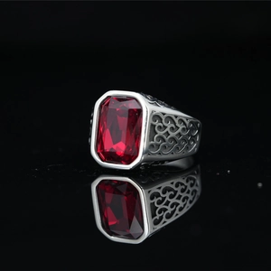 Vintage titanium steel ring with rectangular red gemstone and ornate carved patterns