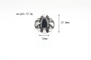 Macro shot of punk black onyx ring with silver claw setting and size specifications