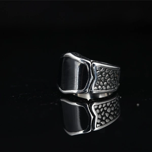 Titanium steel men's ring with black drip glue inlay and hammered texture on black base