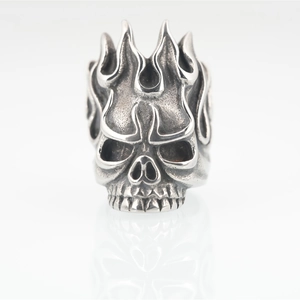 Retro punk titanium steel skull ring with flame crown design and vintage oxidized finish