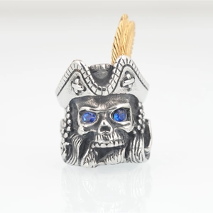 Vintage pirate skull ring in stainless steel with gold feather and blue zircon eyes