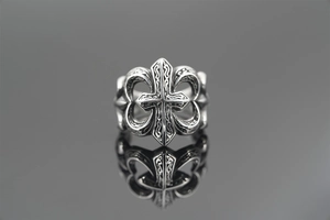 Macro shot of retro gothic cross ring with oxidized silver finish and fleur-de-lis detail