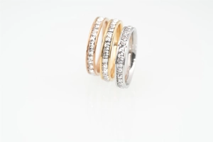 Detailed macro view of eternity rings with square-cut zircons in gold, silver, and rose gold