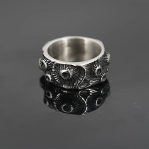 Vintage industrial style silver titanium steel ring with unique radial textured hollows