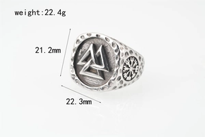 Detail of Viking Valknut ring in stainless steel with Vegvisir symbols and relief carvings
