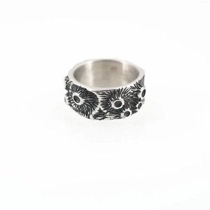 Vintage punk style wide titanium steel ring with textured engravings and black stone inlays