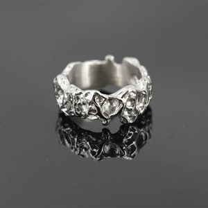 Irregular textured titanium steel ring with silver lava aesthetic and liquid metal design