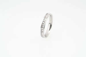 Close-up of eternity titanium steel ring with channel-set square-cut cubic zirconia