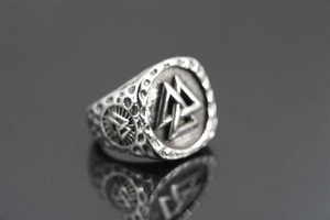 Macro shot of Viking Valknut ring in retro steel with detailed nordic engraving