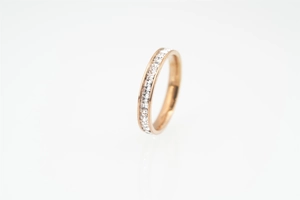 Detailed view of rose gold eternity ring with channel-set square-cut cubic zirconia