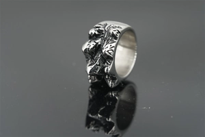 Macro shot of wide titanium steel ring with realistic textured mountain rock pattern