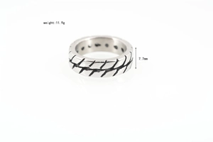 Detail of vintage tire-tread titanium steel ring with dimensions 7.7mm width and 11.9g weight