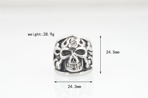 Macro shot of punk skull ring with 28.9g weight specs and detailed crossbone design