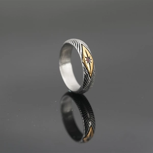 Vintage sunburst titanium steel ring with feather textures and centered red zircon stone