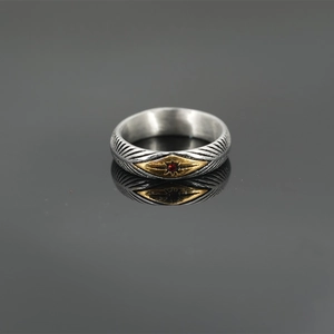 Retro stainless steel sunray ring with gold accents and a central red gemstone