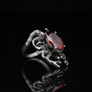 Gothic forest branch ring in titanium steel with red heart crystal and vintage thorn details