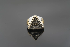 Detailed close-up of retro punk Eye of Horus ring with gold cross accent on black mirror