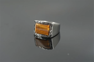 Detailed view of rectangle tiger eye stone inlay on retro stainless steel ring for men
