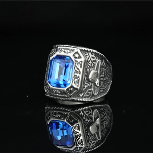 Punk style titanium steel eagle ring with large emerald-cut blue gemstone and carvings