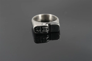 Detailed close-up of matte silver lighter-shaped industrial style stainless steel ring